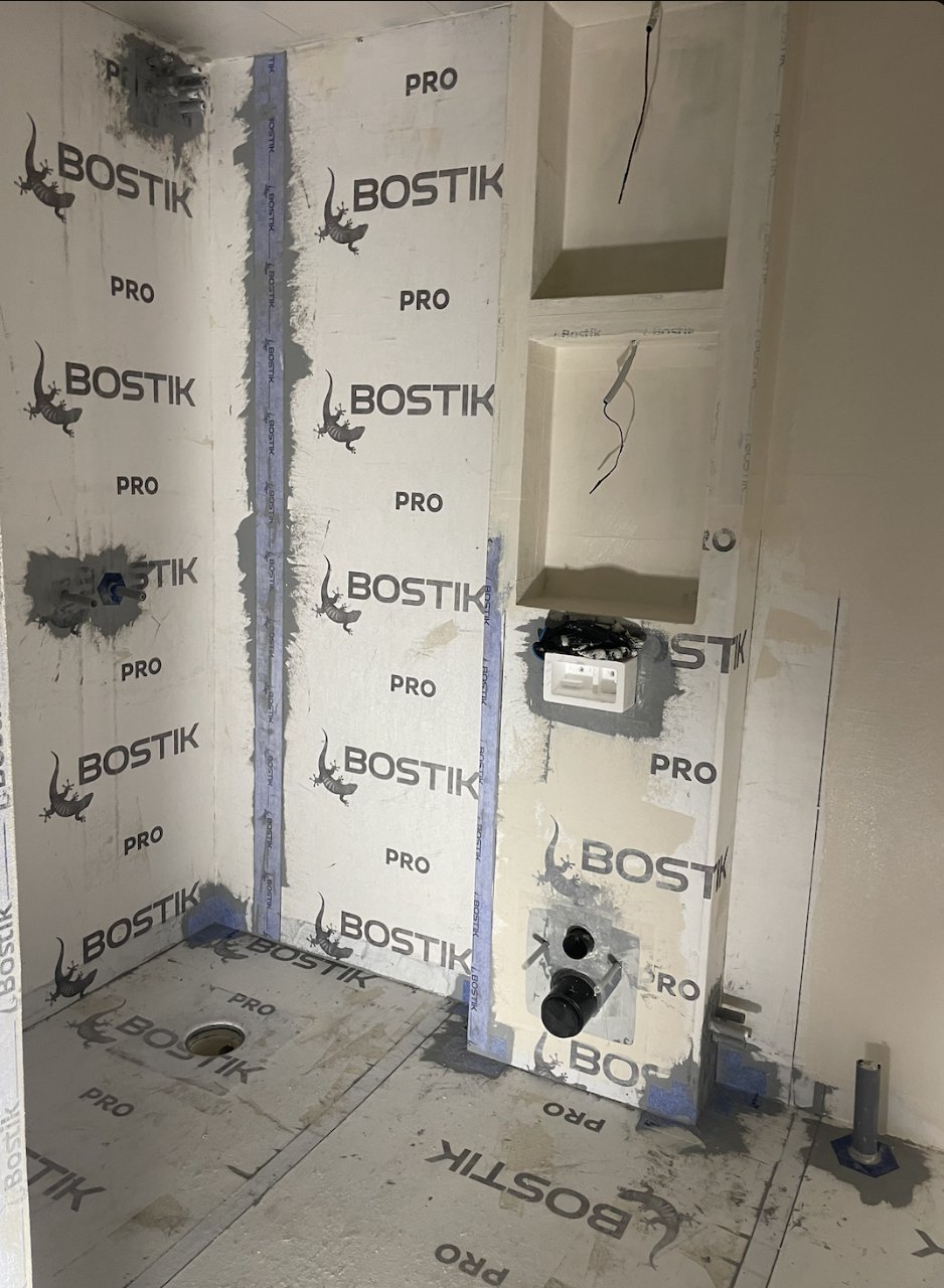 Waterproofing to BBV in progress with sealed joints, prepared niches and WC frame, Majorna